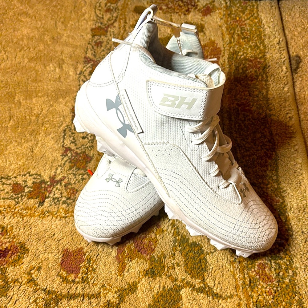 Brand new men's  Under Armour mid top football cleats